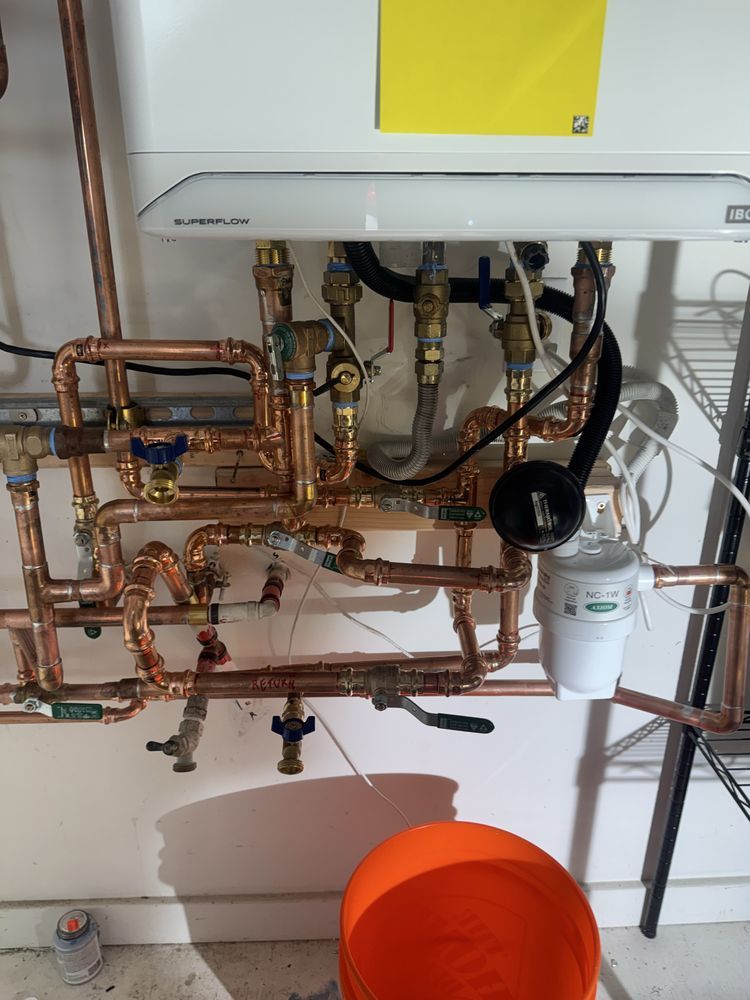 Tankless water heater installation with copper manifold by 5Star Plumbing Indianapolis